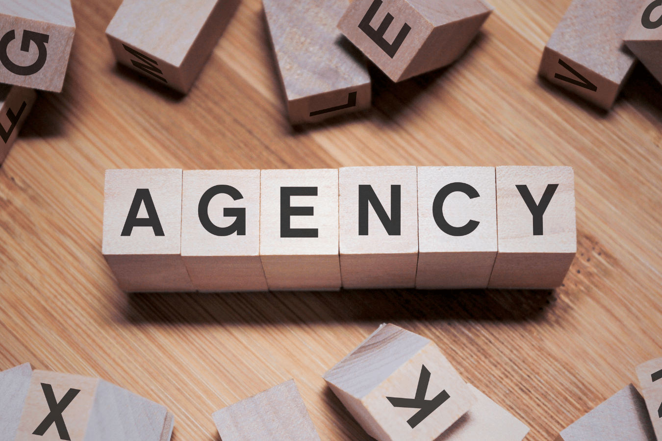Agency written on blocks: digital marketing agency vs in-house pros and cons.