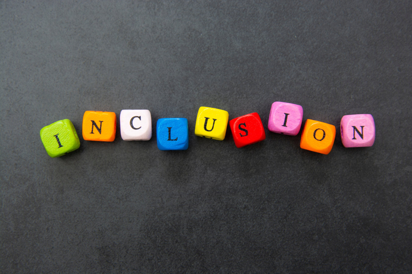 Inclusion spelled out in blocks: tips for creating an inclusive work environment.