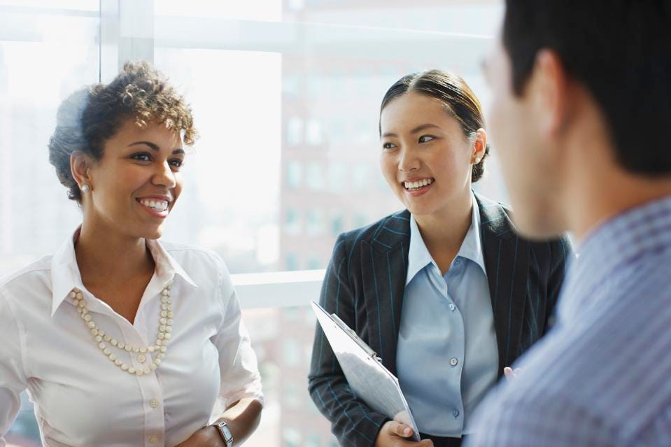 Business women in office setting.